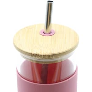 A drink bottle with a pink sleeve, bamboo lid, and a metal straw. It features a logo on the side.