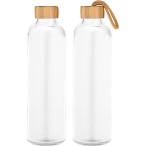 A drink bottle featuring a clear glass body and a bamboo lid, some with a leather strap.