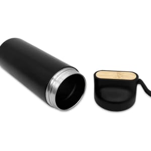 A drink bottle in sleek black with a bamboo lid, featuring a metallic finish and a removable cap.