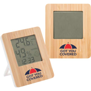 A bamboo desk clock featuring a digital display for temperature and humidity, with a stand and branding on the front.