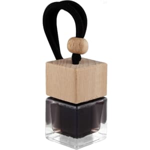 A black car reed diffuser in a clear glass container, topped with a wooden cap and a black cord.