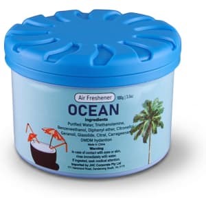A blue air freshener container with a lid, labelled "Ocean," featuring tropical drink illustrations.