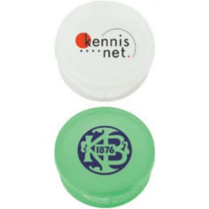 Two pill boxes, one white with a logo and one green featuring a different logo, both designed for personal use.