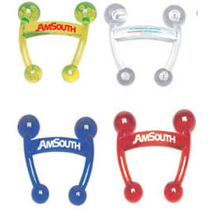 A set of four massagers in yellow, clear, blue, and red, each featuring a logo.