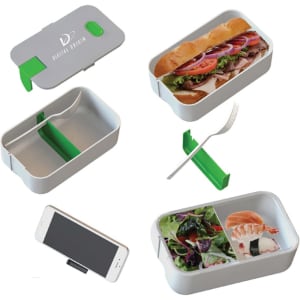 A grey lunch box with a green lid, compartments for food, a fork, and a spot for a phone. It features a logo.