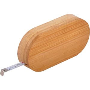 A bamboo bottle opener with a silver tape measure protruding from one end and a smooth, rounded design.