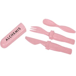 A pink cutlery set made from wheat straw, including a knife, fork, and spoon, accompanied by a rectangular holder.