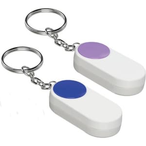 A pill box set featuring two white containers with purple and blue circular lids, attached to keyring chains.