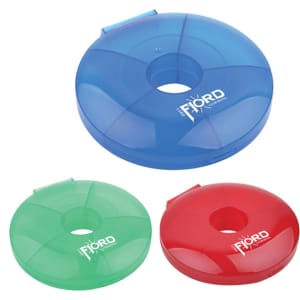 Three circular pill boxes in blue, green, and red, each featuring a logo. They are transparent with a hollow centre.