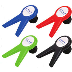 A set of four wine stoppers in blue, red, green, and black, each featuring a logo.