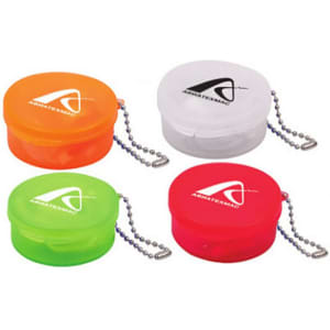 A set of four round cases in orange, white, green, and red, each with a keyring and logo.