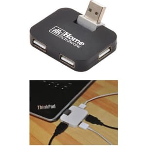 A black USB hub featuring multiple ports, with a logo, positioned near a laptop and connected cables.