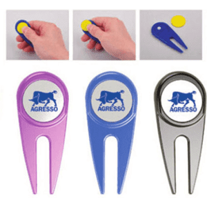 A selection of golf tees in pink, blue, and silver, each featuring a logo at the top.