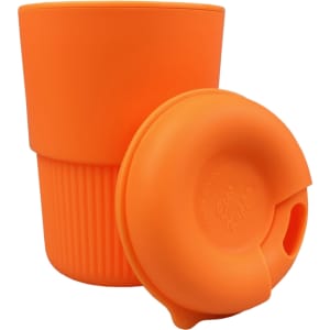 A reusable coffee cup in bright orange silicone with a matching lid, featuring a ribbed texture and a logo.