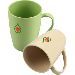 A set of reusable bamboo mugs in green and beige, each featuring a small logo.