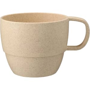 A reusable coffee cup in a light beige shade with a handle and a textured finish, featuring a brand logo.