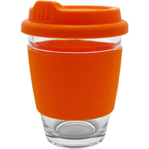 A glass coffee cup with an orange silicone sleeve and lid, featuring a curved shape and a logo.