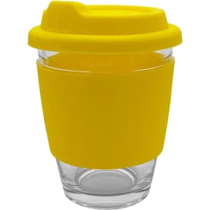A reusable coffee cup made of glass with a bright yellow silicone lid and sleeve. Features a logo.