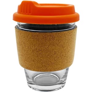 A glass coffee cup with a cork sleeve and an orange lid. The design is reusable and eco-friendly.