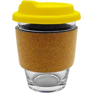 A glass coffee cup with a cork sleeve and a yellow lid, designed for reusable drinkware.