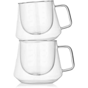 A set of two transparent glass coffee cups with a modern design and curved handles, featuring a sleek, minimalist look.
