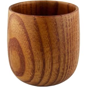 A small wooden coffee cup with a smooth, polished finish and natural grain patterns.