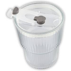 A clear glass ice coffee cup with a ribbed design and a white straw lid featuring a locking mechanism.