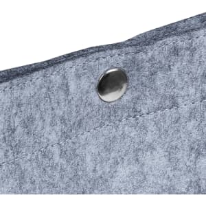 A close-up of a grey felt fabric with a metallic snap button. The texture is soft and slightly fuzzy.