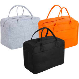 Three travel bags in grey, orange, and black felt material, featuring dual handles and a structured design.