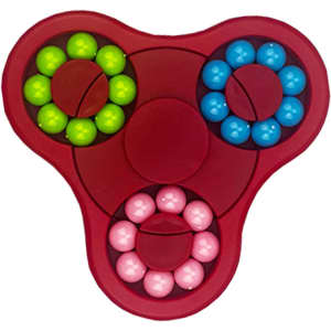 A red fidget spinner featuring blue, green, and pink balls in circular arrangements around a central hub.