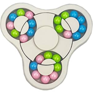 A fidget spinner in white with vibrant blue, pink, green, and purple balls embedded in its design.