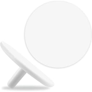 A white golf ball marker with a flat circular design and a small stem for easy placement.