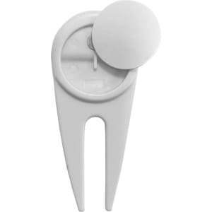 A white plastic golf divot repairer, featuring a circular top and a two-pronged base for repairing turf.