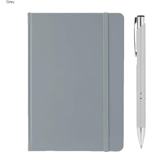 A grey A5 notebook with a matching elastic band and a silver pen beside it. The notebook features a logo on the cover.