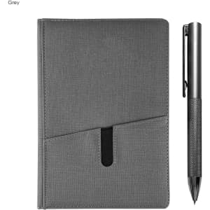 A grey notebook with a sleek textured finish and a silver metal pen beside it. The notebook features a pocket design.