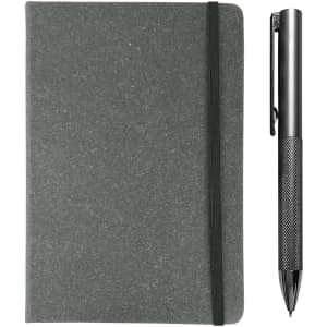 A grey notebook with an elastic band, accompanied by a sleek silver pen. Both are part of the Xander Notebook and Pen Gift Set.
