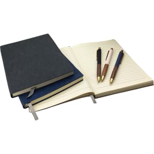 A set of two notebooks in dark blue and black, accompanied by three pens with wooden and metallic accents.