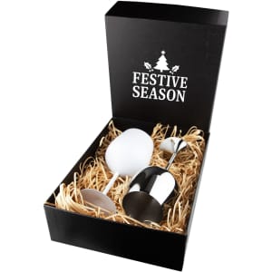 A stainless steel wine glass with a sleek design, presented in a black gift box with festive decorations and straw filling.