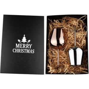 A stainless steel wine glass gift set featuring a rose gold and a white glass, presented in a black box with straw filler.