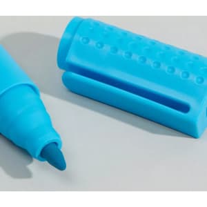 A blue Jumbo Highlighter Pen with a textured grip and cap, featuring a fine tip.