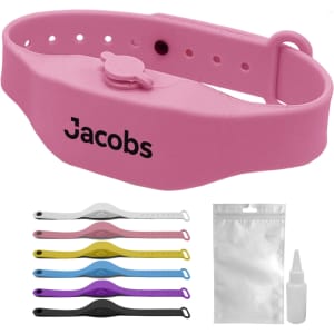 A pink wristband hand sanitiser dispenser with a logo, alongside a variety of coloured bands and a small bottle.