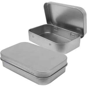 A metal tin in silver featuring a hinged lid, open to reveal an empty interior.