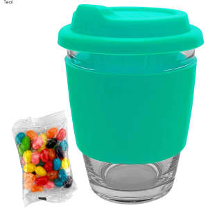 A teal glass coffee cup with a matching silicone lid and sleeve, alongside a bag of colourful jelly beans.