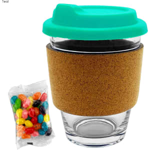 A glass coffee cup with a teal lid, cork band, and a side of colourful jelly beans.