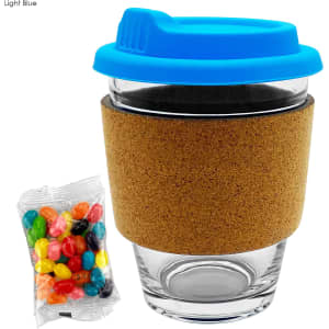 A glass coffee cup with a light blue lid and cork band, accompanied by a bag of colourful jelly beans.