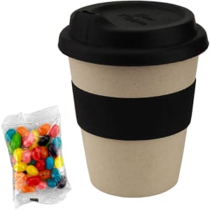 A bamboo cup with a black lid and band, accompanied by a packet of multicoloured jelly beans.