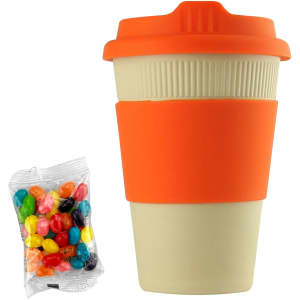 A reusable 12oz bamboo coffee cup in cream and orange, accompanied by a bag of colourful jelly beans.