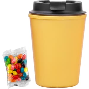 A drink bottle in yellow with a black lid, accompanied by a pack of colourful jelly beans.