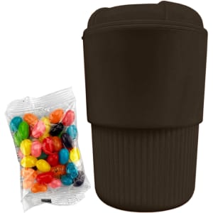 A reusable coffee cup in dark brown, next to a pack of colourful jelly beans. It features a branding logo.