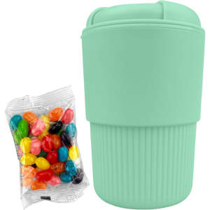 A reusable mint green coffee cup with ribbed texture, accompanied by a pack of colourful jelly beans.